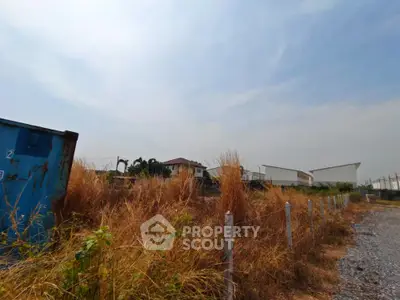 Expansive land plot with potential for development under clear skies