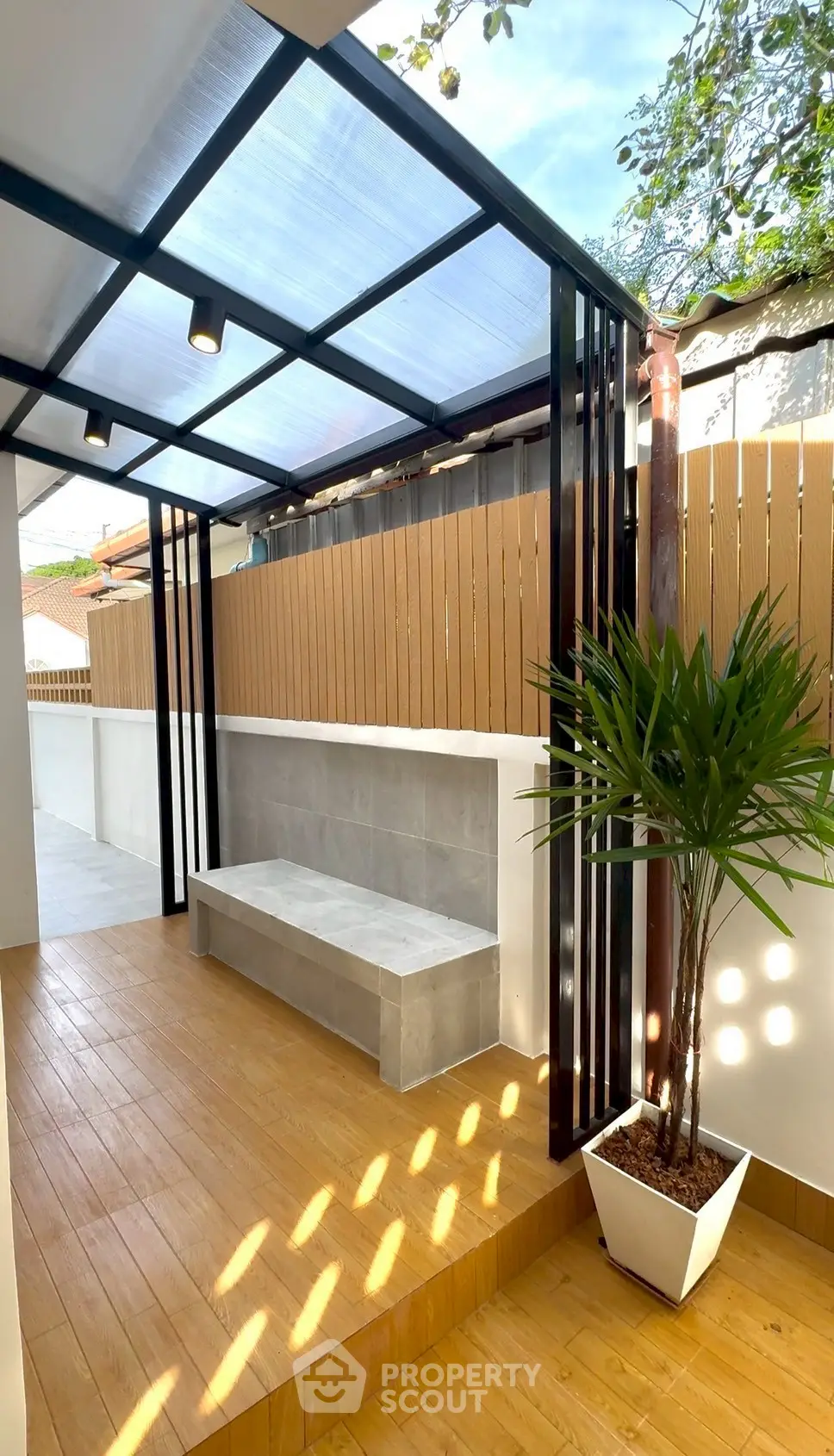 Stylish outdoor patio with modern design and wooden flooring, perfect for relaxation and entertaining.