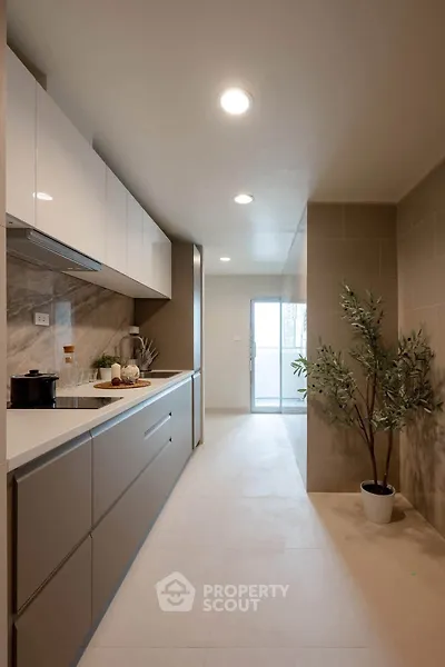 Modern kitchen with sleek cabinetry and natural light