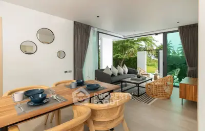 Modern open-plan living room with dining area and garden view