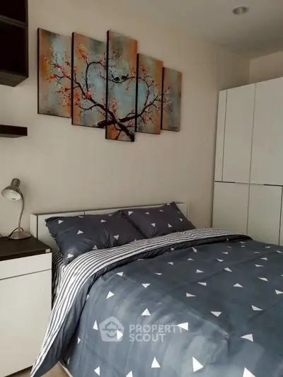 Modern bedroom with stylish decor and cozy bedding