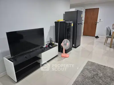 Modern living space with sleek appliances and minimalist decor