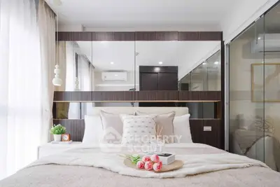 Luxurious modern bedroom with elegant decor and ample natural light