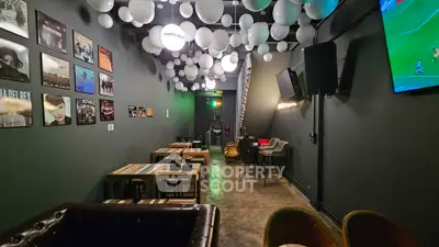 Chic modern lounge with stylish decor and ambient lighting, perfect for relaxation and entertainment.