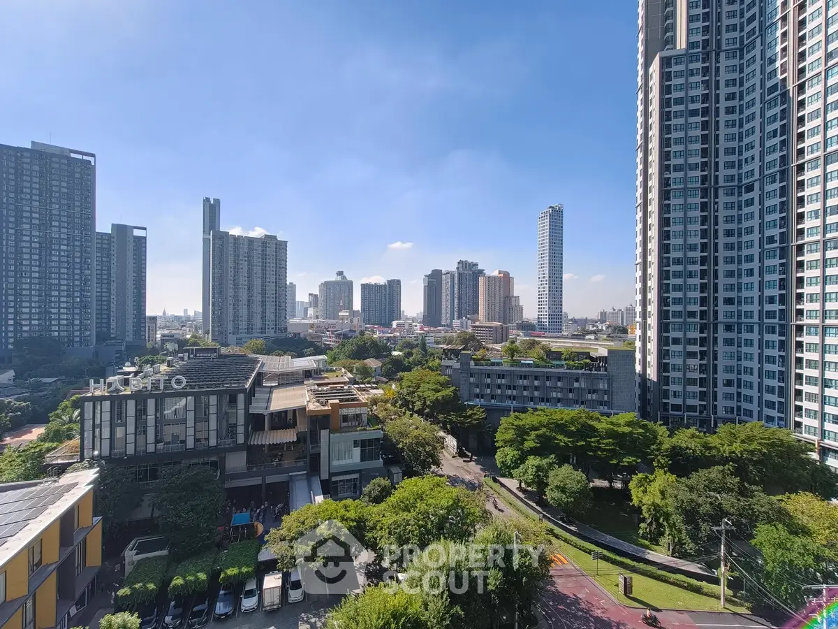 Stunning cityscape view with modern high-rise buildings and lush greenery