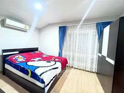 Cozy bedroom with colorful bedding and modern furniture