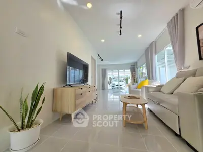 Spacious modern living room with sleek furniture and natural light