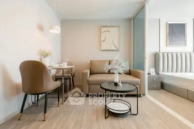 Modern living room with elegant decor and cozy seating in a stylish apartment.