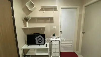 Cozy living room corner with TV stand and modern decor