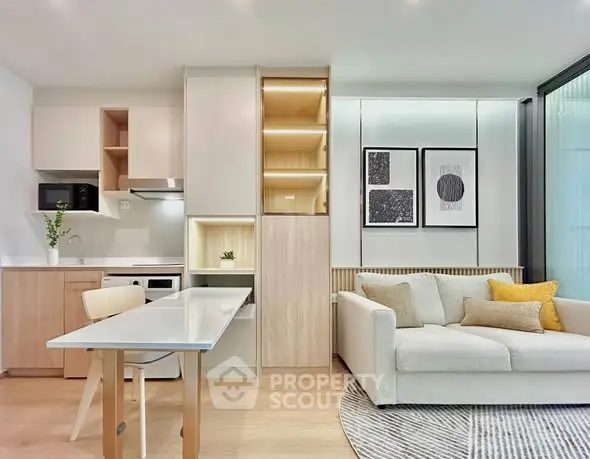 Modern open-plan living room with stylish kitchen and cozy seating area