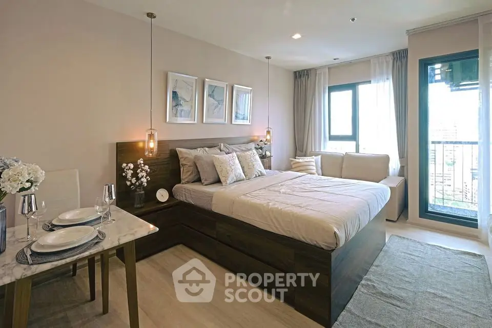 Luxurious bedroom with elegant decor and balcony access in modern apartment