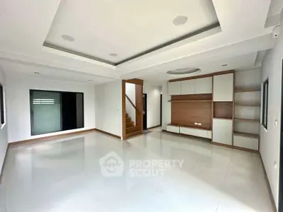 Spacious modern living room with sleek design and ample natural light