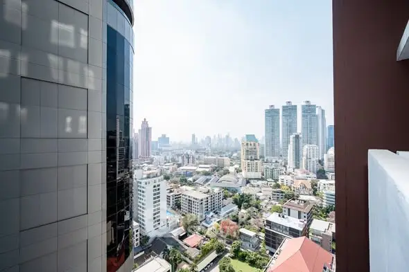 Stunning cityscape view from high-rise building balcony
