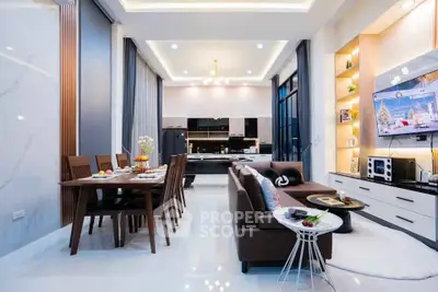 Luxurious modern living room with open kitchen and elegant dining area