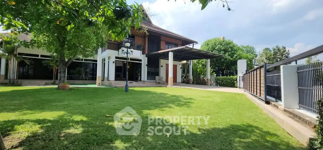 Luxurious modern house with lush green garden and spacious outdoor area