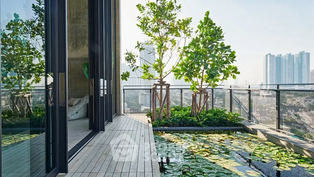 Luxurious balcony with stunning city view and elegant water feature