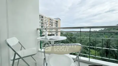 Charming balcony with scenic view of lush greenery and modern apartment building.