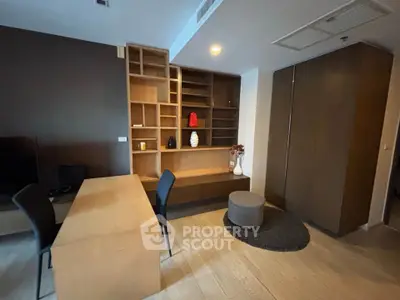 Modern study room with wooden desk and built-in shelves