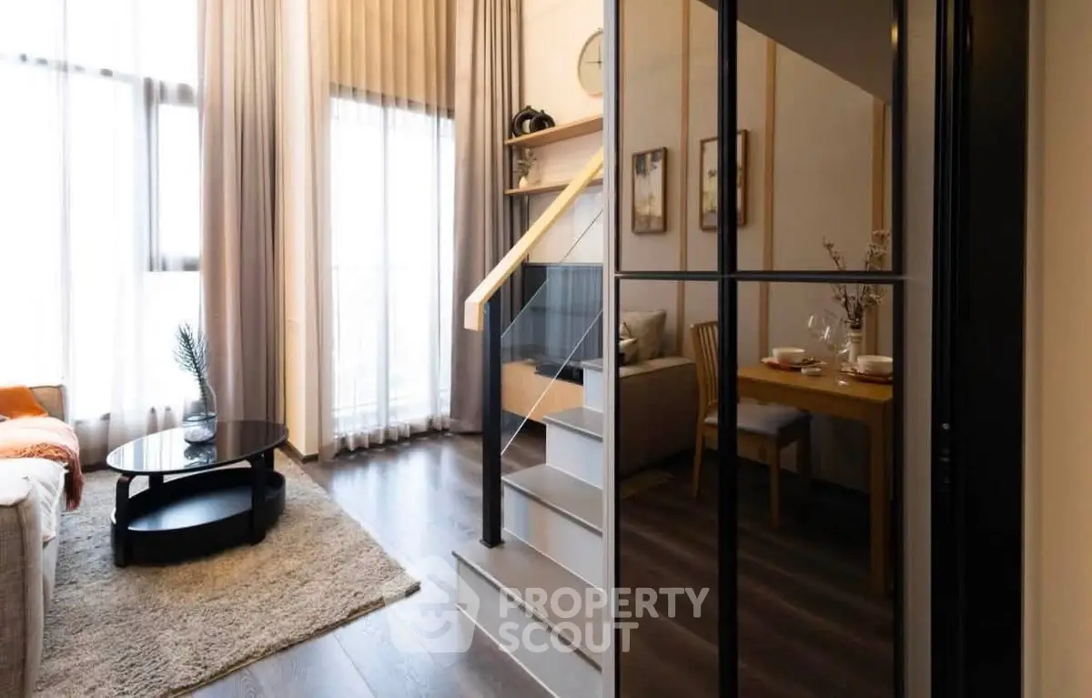 Modern duplex living room with stylish decor and dining area