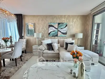 Luxurious living room with elegant decor and large windows offering natural light
