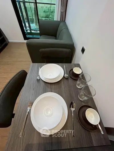 Cozy dining area with elegant table setting in modern apartment