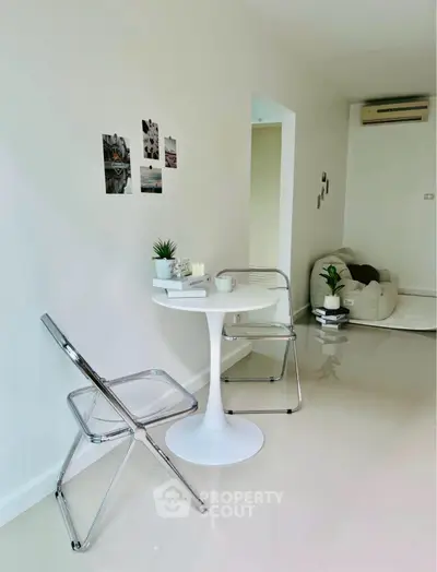 Modern minimalist living area with sleek furniture and bright decor