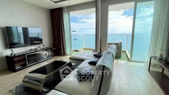 Luxurious living room with stunning ocean view and modern furnishings.