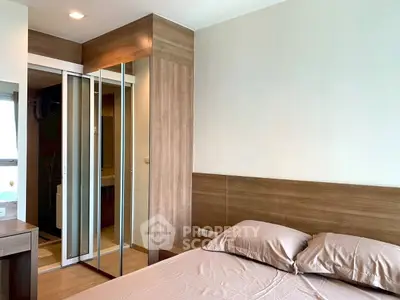 Modern bedroom with wooden accents and mirrored closet doors