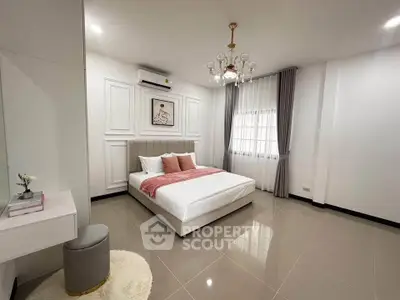 Spacious modern bedroom with elegant decor and natural light