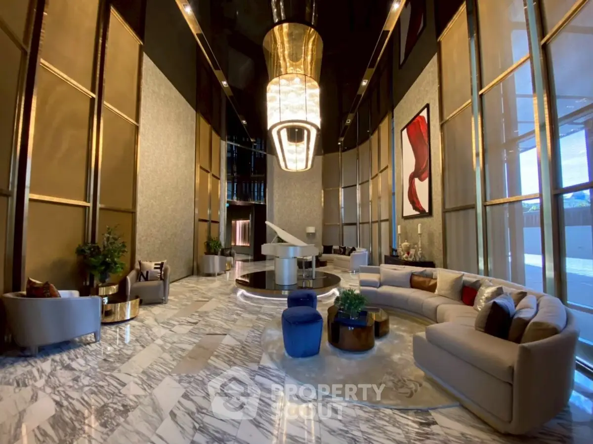 Luxurious modern lobby with elegant marble flooring and grand chandelier