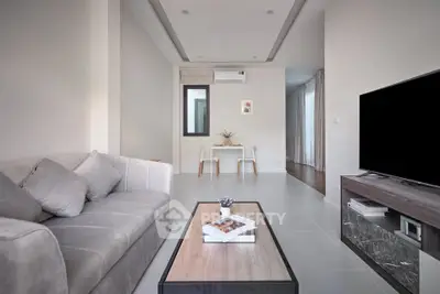 Modern living room with sleek furniture and neutral tones