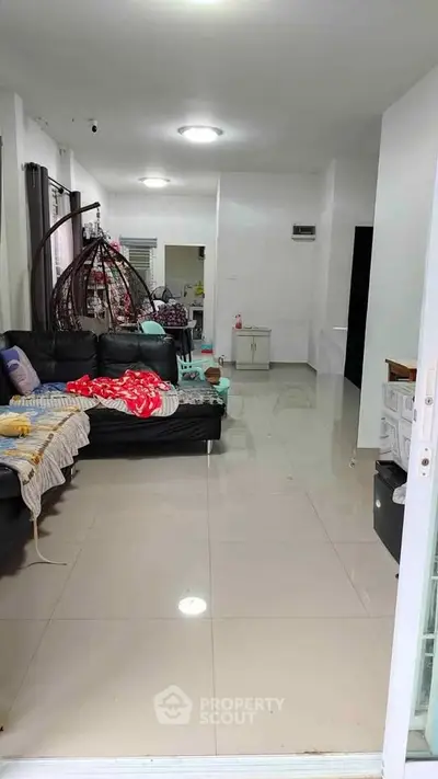 Spacious living room with modern furniture and bright lighting