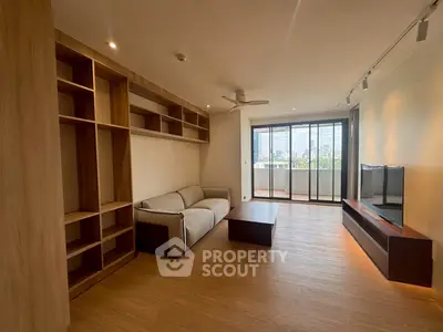 Spacious modern living room with city view and stylish wooden furniture