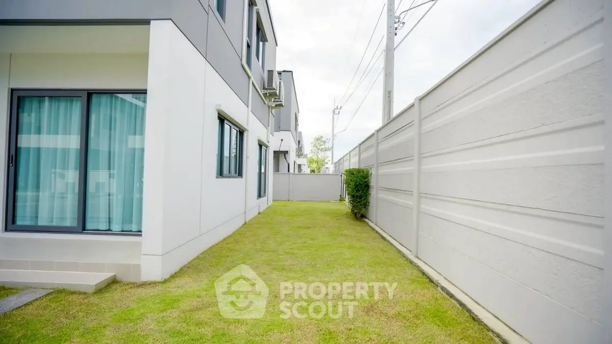 Modern townhouse with spacious side garden and sleek exterior design