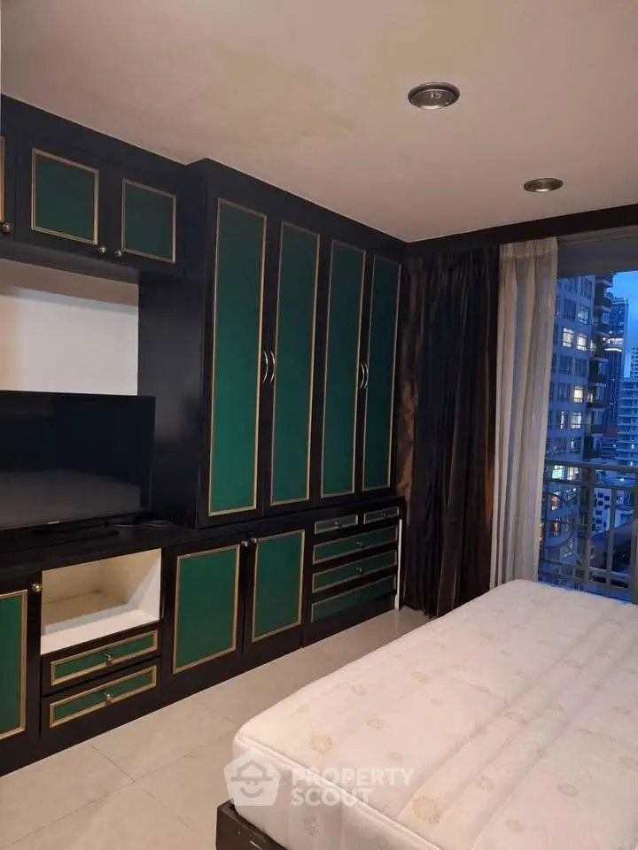 Luxurious bedroom with elegant built-in wardrobe and city view