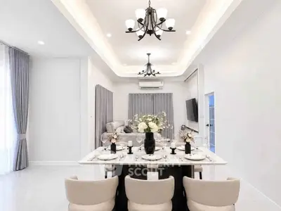 Luxurious modern dining room with elegant chandelier and stylish decor