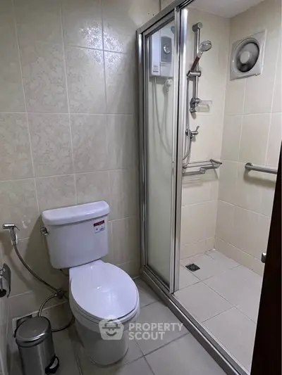 Compact bathroom with shower enclosure and modern fixtures