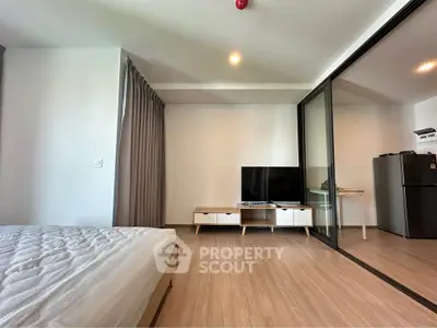 Modern studio apartment with open layout and sleek furnishings