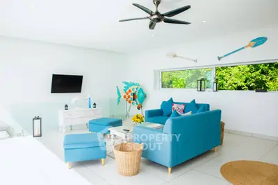 Bright modern living room with blue furniture and vibrant decor