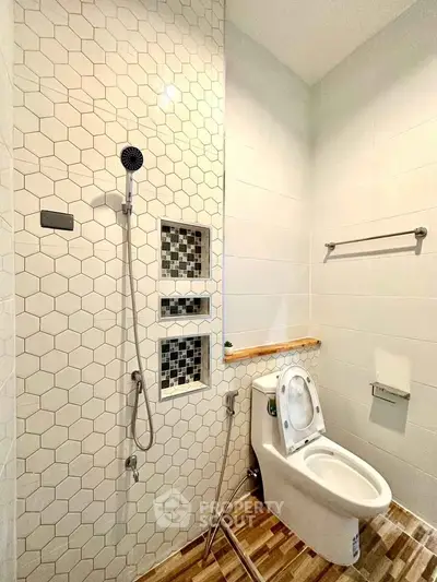 Modern bathroom with stylish hexagonal tiles and sleek fixtures