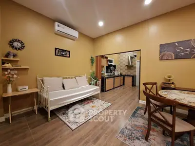 Charming living room with cozy seating and open kitchen layout