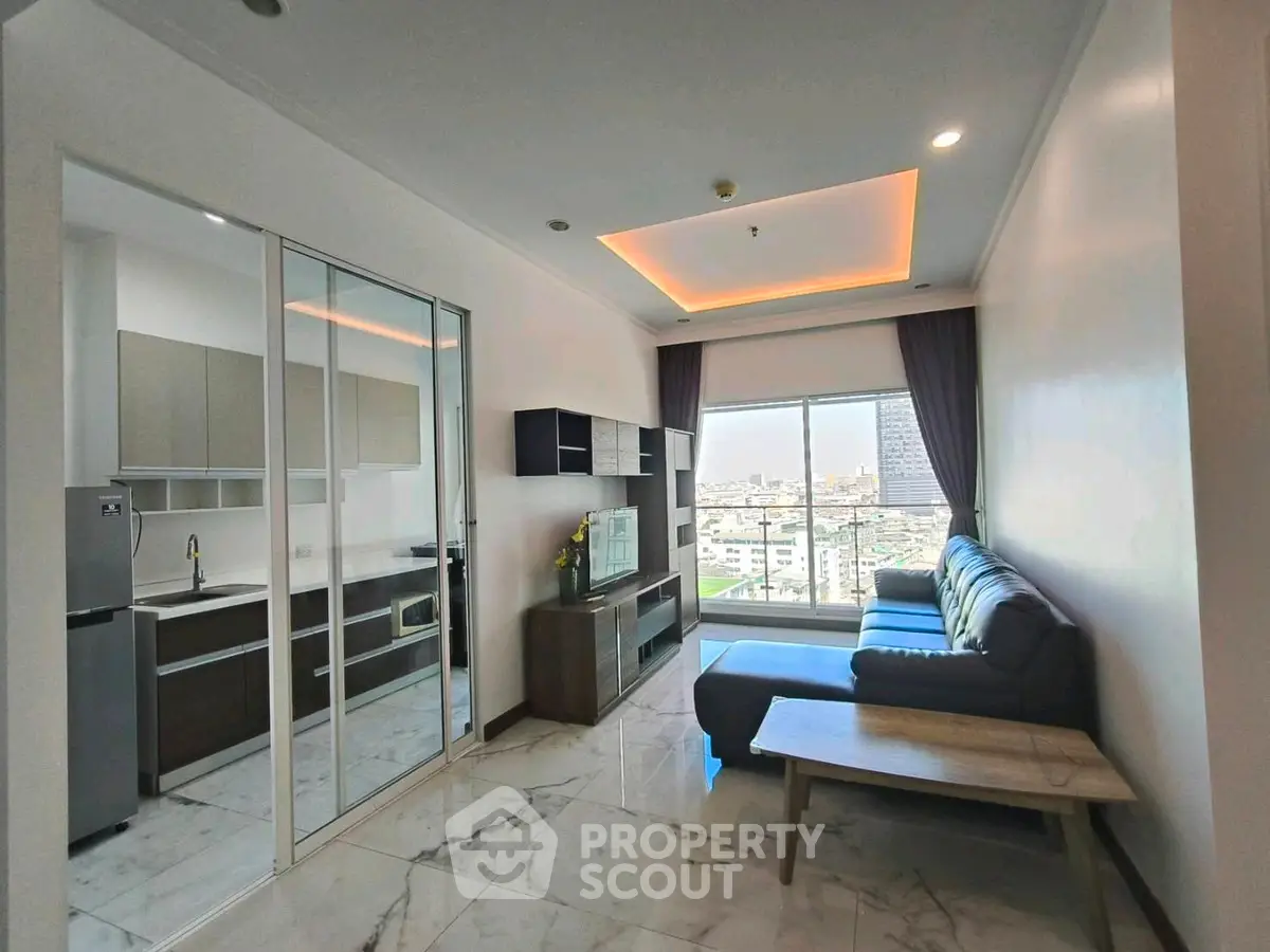 Modern living room with city view and sleek kitchen design