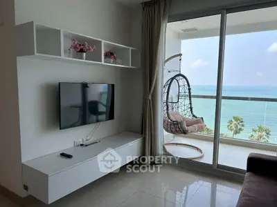 Modern living room with ocean view and stylish balcony seating