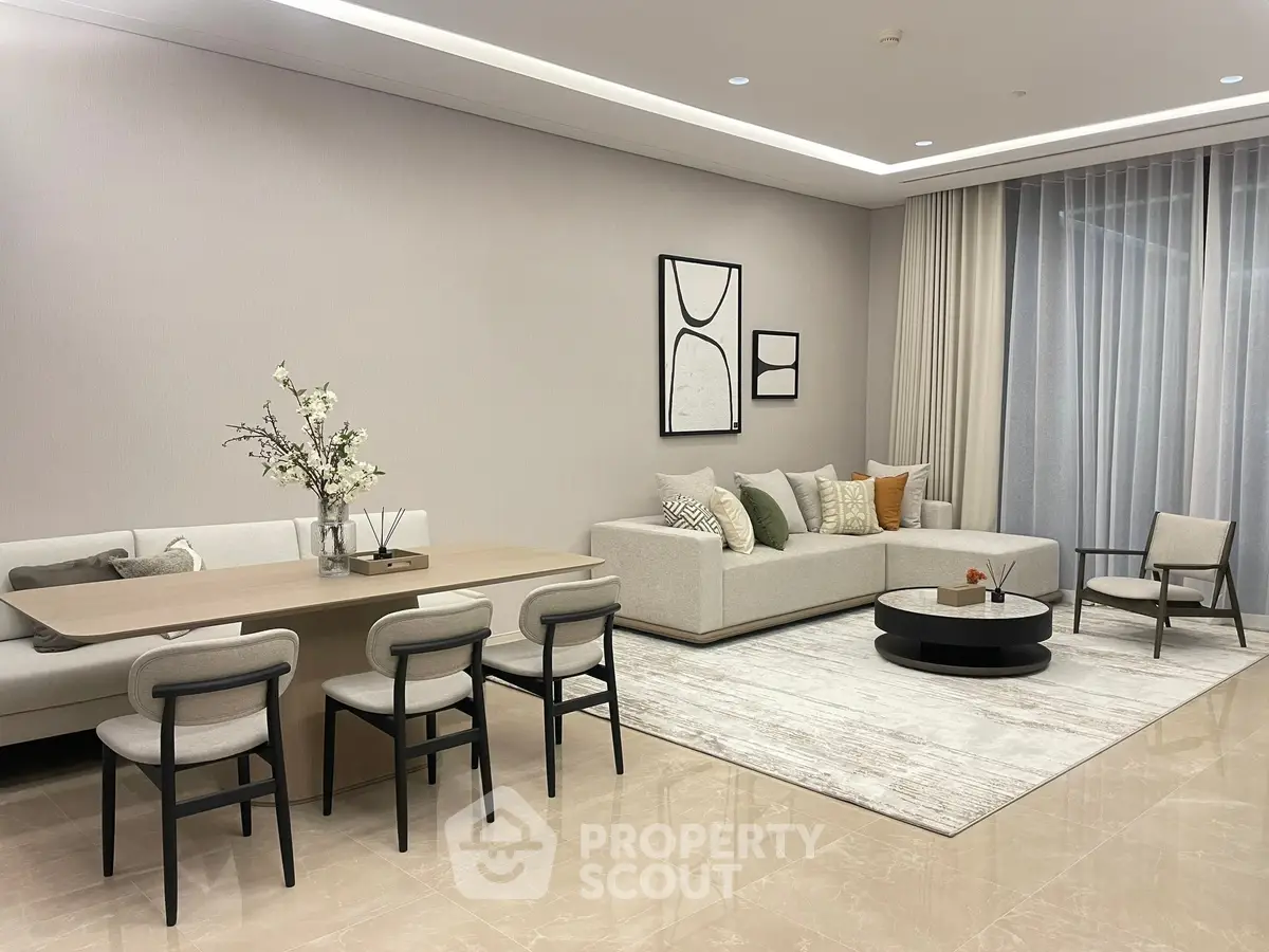 Elegant modern living room with stylish furniture and neutral tones, perfect for relaxation and entertaining.