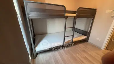 Cozy bedroom with modern bunk bed and wooden flooring