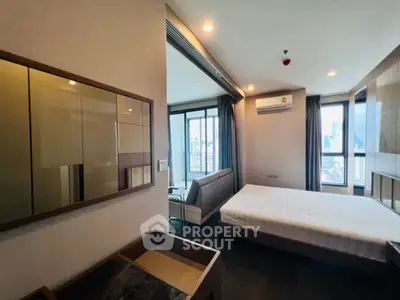 Modern bedroom with city view and sleek furnishings