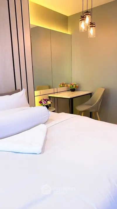 Modern bedroom with elegant decor and cozy seating area