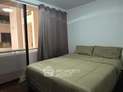 Cozy bedroom with balcony view in modern apartment