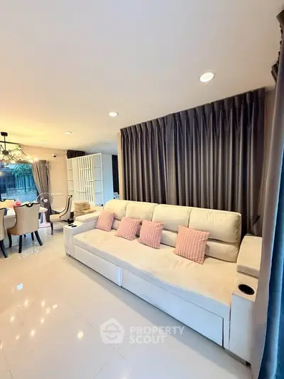 Spacious living room with elegant decor and modern furniture, perfect for relaxation and entertaining.