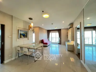 Spacious modern living room with dining area and balcony access